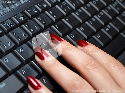 Image of Woman typing on a keyboard