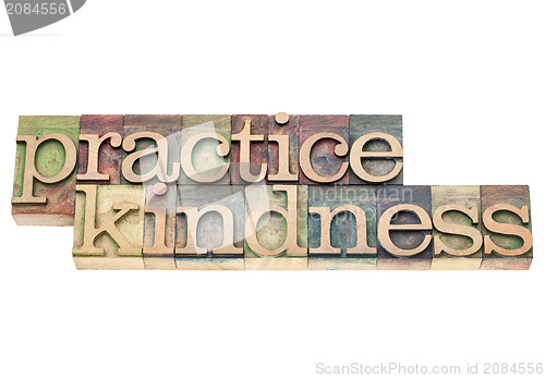 Image of practice kindness in wood type