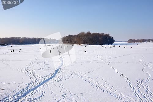 Image of Winter fishing on frozen reservoir