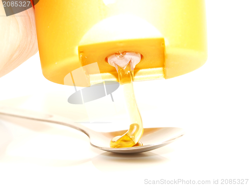 Image of Honey onto spoon