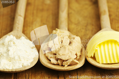 Image of baking ingredients butter, yeast and meal