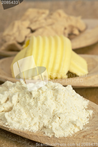 Image of baking ingredients butter, yeast and meal
