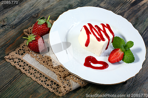 Image of Panna cotta with cherry sauce.