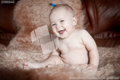 Image of child sitting on fur