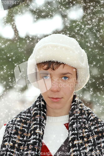 Image of Handsome teen boy in white fur hat