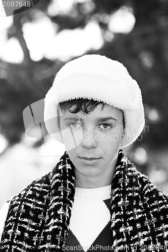 Image of Handsome teen boy in white fur hat