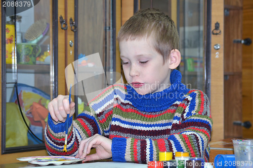 Image of The boy at a drawing lesson