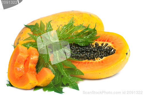 Image of Ripe papaya and slices with seeds and green leaf isolated on a w