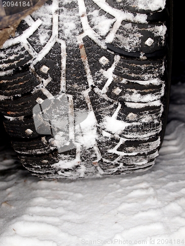 Image of Car tire on snow