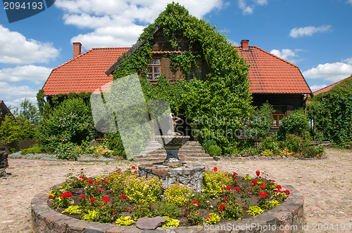 Image of Woody home in green with garden