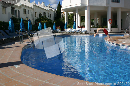 Image of person diving into a swimming pool