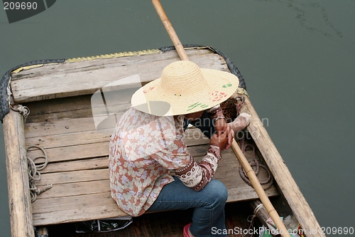 Image of Chinese girl on a boat