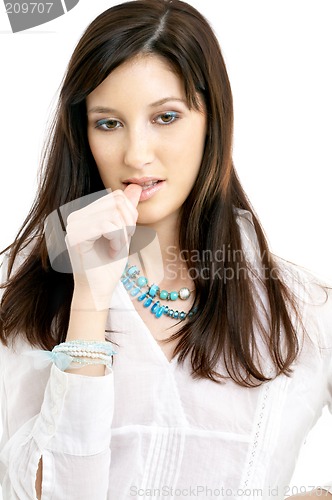 Image of thoughtful brunette in white shirt