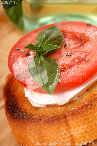 Image of Bruschetta with tomato, mozzarella and basil
