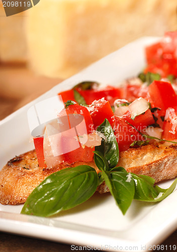 Image of Bruschetta with tomato, mozzarella and basil