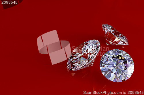 Image of Three diamonds on red glossy background