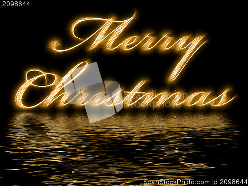 Image of Merry Christmas - written with reflection in rippled water