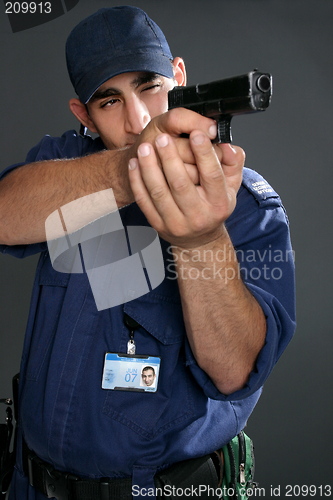 Image of Security Officer takes aim