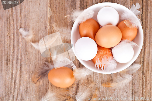 Image of brown and white eggs in a bowl