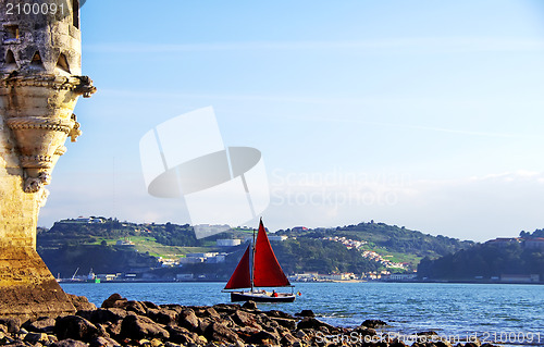 Image of Red sailboat on Tejo river, Portugal