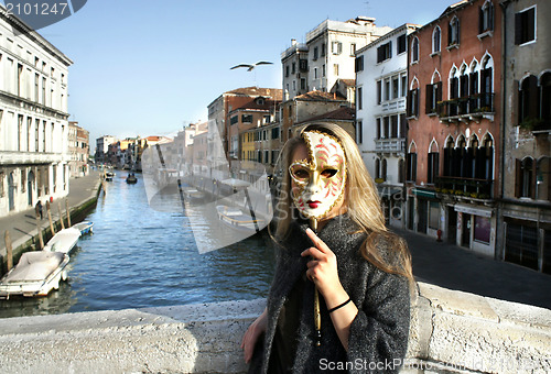 Image of Woman in beautiful Venetian mask in Venice