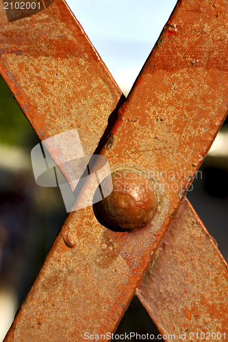 Image of iron metal cross in the railway