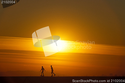 Image of Roller skating at  sunset