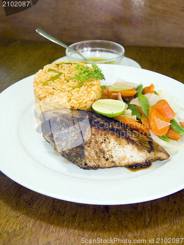Image of yellowfin tuna steak with vegetables rice