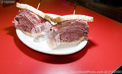 Image of combination tongue corned beef sandwich seeded rye bread