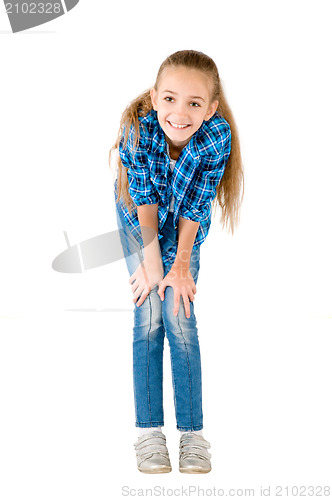 Image of The girl in jeans and a checkered shirt