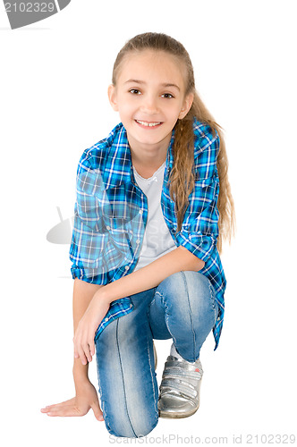 Image of The girl in jeans and a checkered shirt