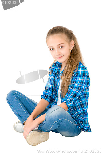 Image of The girl in jeans and a checkered shirt
