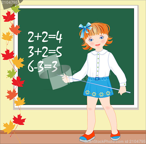 Image of Back to school.  Schoolgirl on the lesson of mathematics.