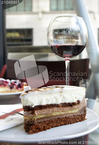 Image of Red wine and tiramisu in Parisian cafe 