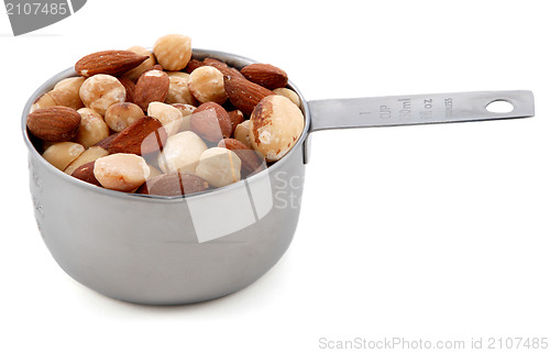 Image of Mixed nuts presented in an American metal cup measure