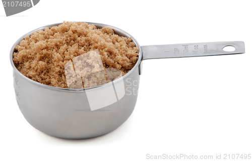 Image of Light brown soft / muscovado sugar presented in a cup measure