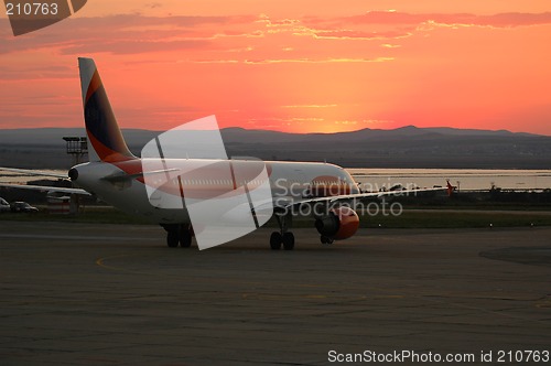 Image of Plane and sunset