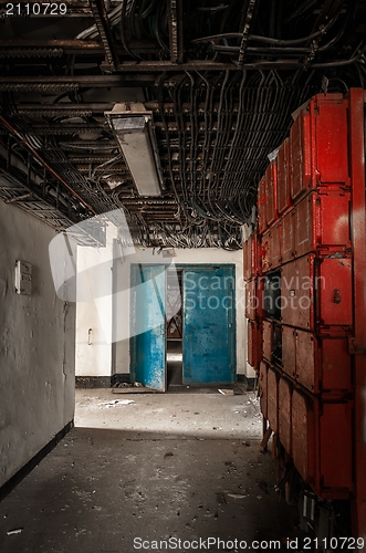 Image of Corridor with a lot of junction boxes and cables