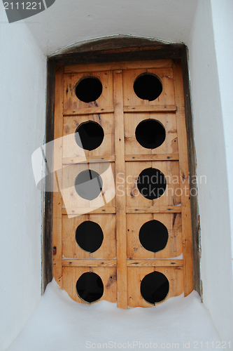 Image of Ancient wooden window in a wall