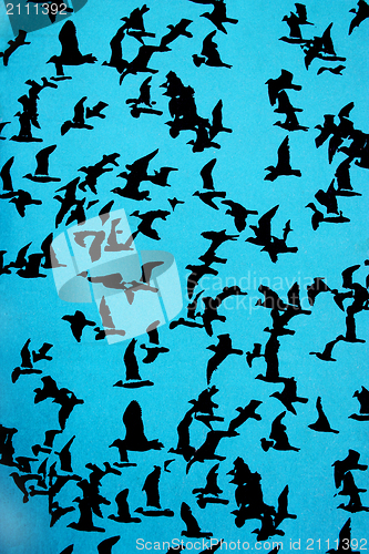 Image of Set of silhouettes of birds on a blue background