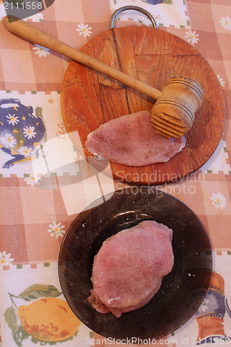 Image of Process of cooking of chops, meat and hammer