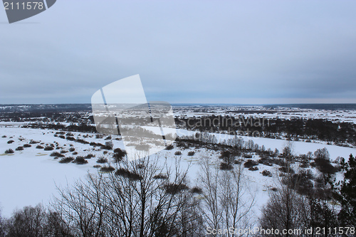 Image of Winter landscape with frozen river and snow