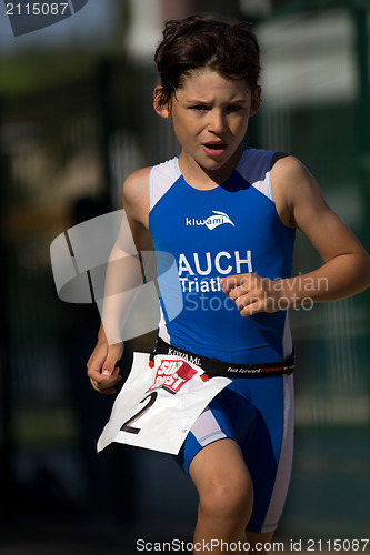 Image of Very young triathlete running