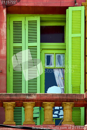 Image of light green wood venetian blind