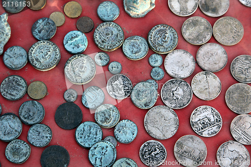 Image of Collection of old coins from different countries, El-Jem market, Tunisia