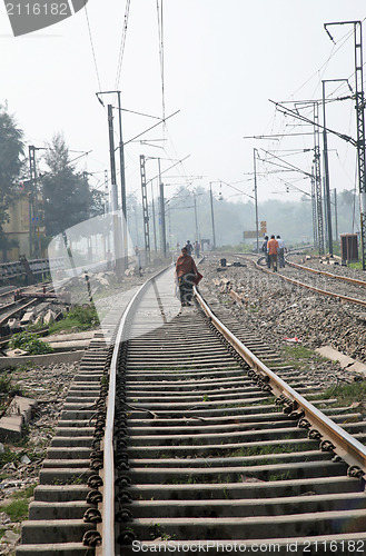 Image of A woman walking on the railroad, Baruipur West Bengal