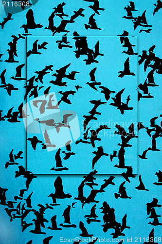 Image of Set of silhouettes of birds on a blue background