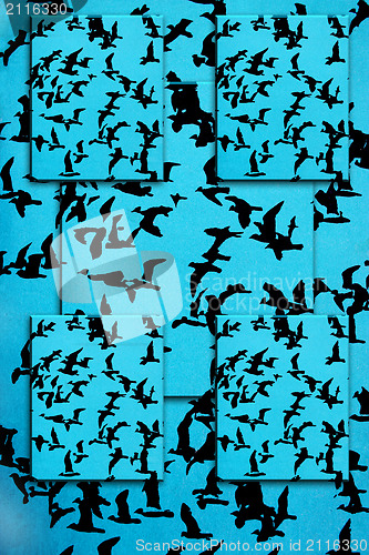 Image of Set of silhouettes of birds on a blue background
