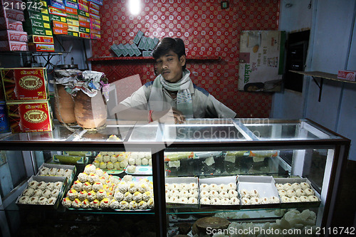 Image of Portrait of the traders in the shop in Baruipur, West Bengal, India