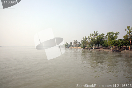 Image of A stunning sunrise looking over the holiest of rivers in India. Ganges delta in Sundarbands, West Bengal, India.